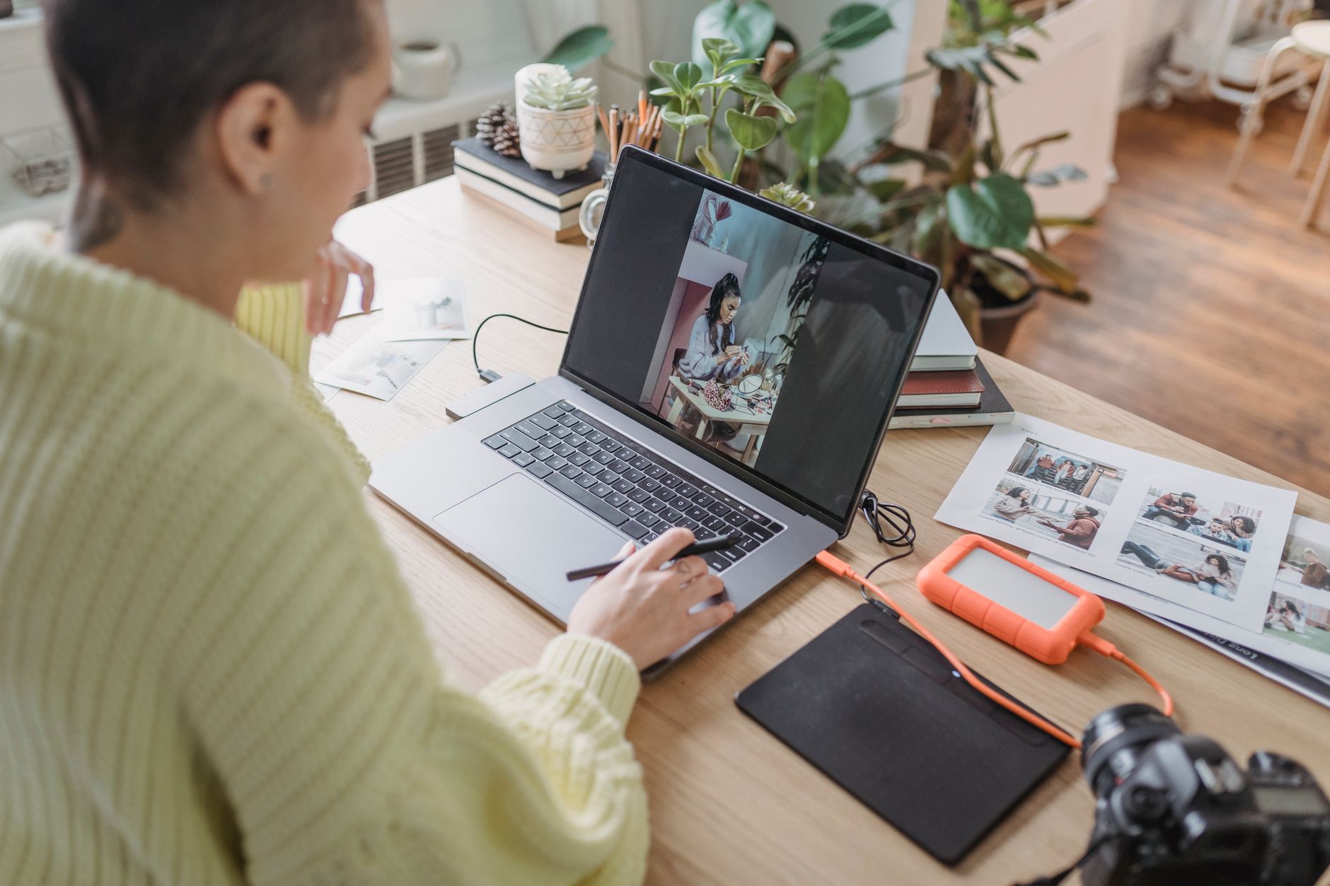 A professional photo editor working on a large high-resolution desktop monitor