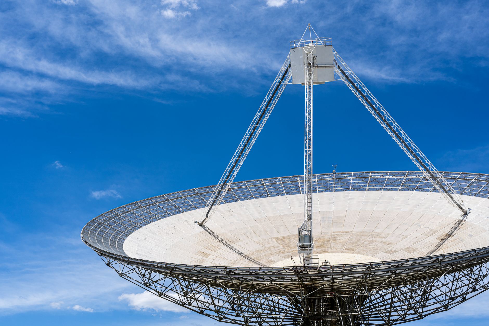 Satellite spacecraft orbiting above a planetary surface in deep space