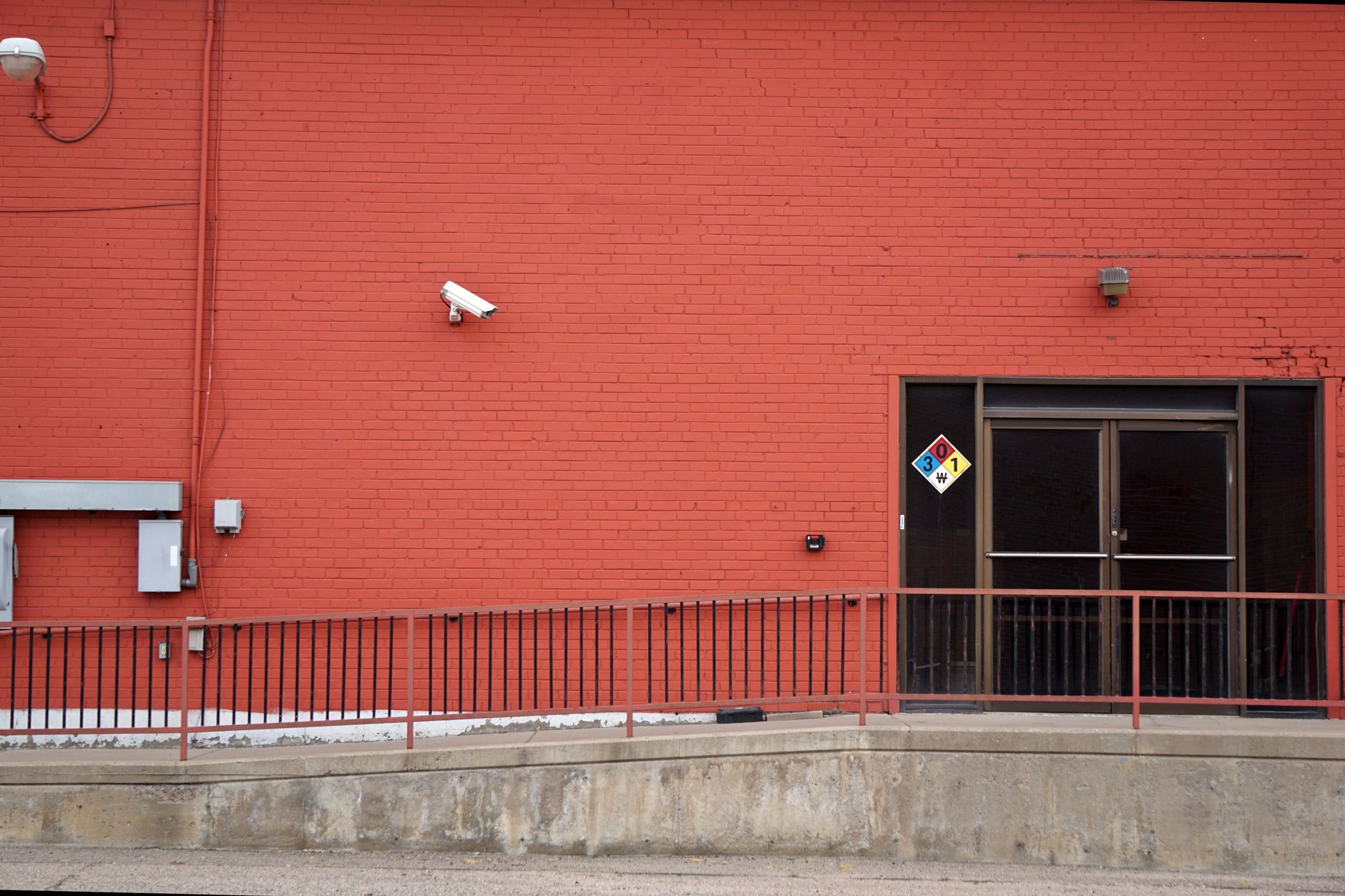 Security camera mounted in a busy urban environment representing digital surveillance concerns