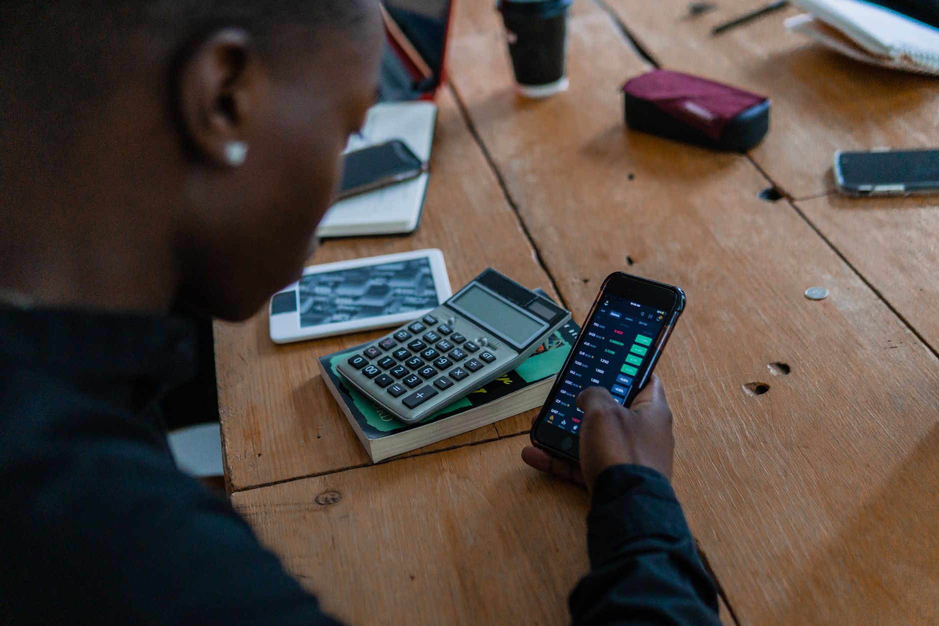 Person using a folding smartphone during everyday daily activities
