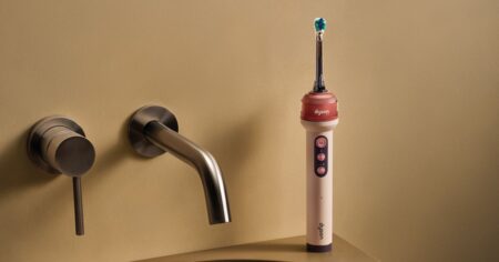 Dyson’s Next Act Is an Electric Toothbrush With a Camera Modern electric toothbrush on a bathroom counter representing advanced oral care technology