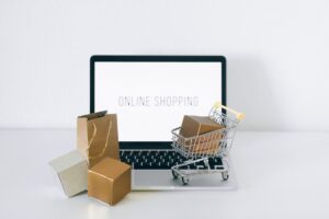 Prime Day 2026 Is Over, But Discounts Are Still Running Person browsing online deals on a laptop with a shopping cart icon visible on screen
