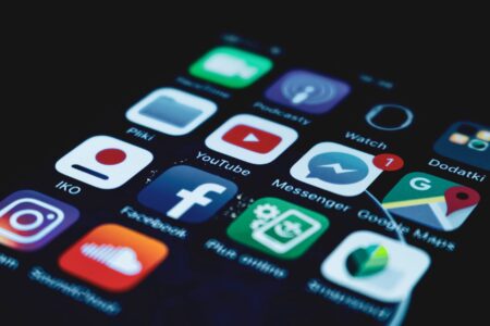 Meta Blocks ByteDance Ads in Direct Strike at TikTok Smartphone screen showing social media platform icons including Facebook and Instagram