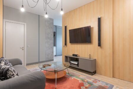 Bose Lifestyle Ultra Soundbar Skips the Subwoofer, Delivers Anyway Sleek soundbar mounted below a wall television in a modern living room