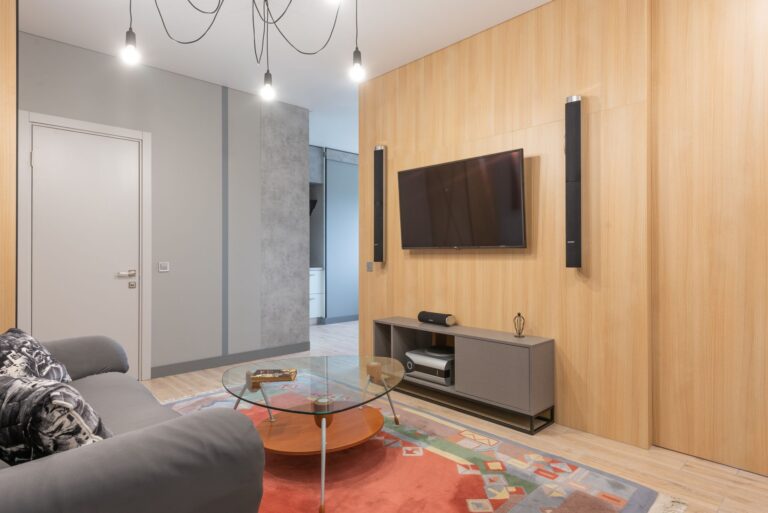 Bose Lifestyle Ultra Soundbar Skips the Subwoofer, Delivers Anyway Sleek soundbar mounted below a wall television in a modern living room