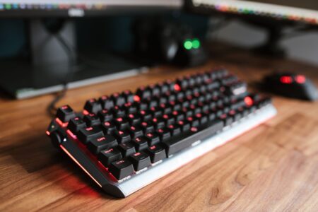 Long live the mechanical keyboard Mechanical keyboard on a wooden desk with backlighting