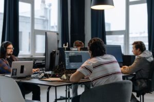 Empty startup office with abandoned desks and computers after company shutdown