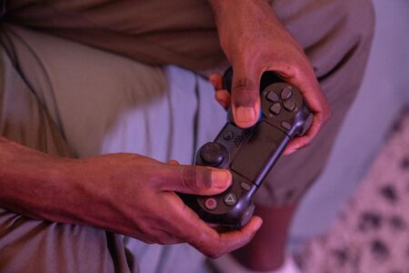 Xbox has a teeny new gamepad Person holding a compact video game controller in one hand