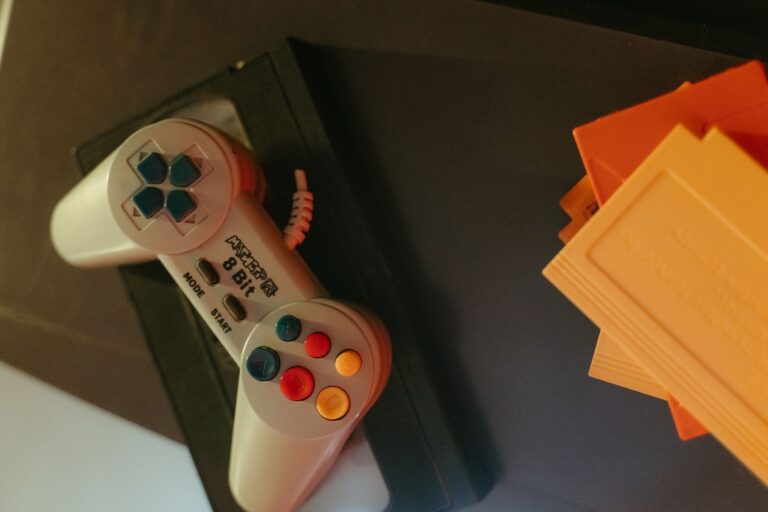 Analogue Revives Genesis and SNES Hardware with Mega Sg+ and Super Nt+ Collection of vintage 16-bit video game cartridges on a wooden surface