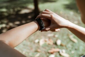 Apple Watch Ultra 4 Action Button Uses Explained Person wearing an Apple Watch Ultra on their wrist outdoors during a workout