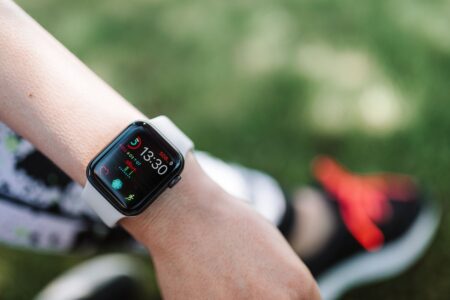 Apple Watch Theater Mode: What It Does and When to Use It Person wearing an Apple Watch with the screen off in a dark environment
