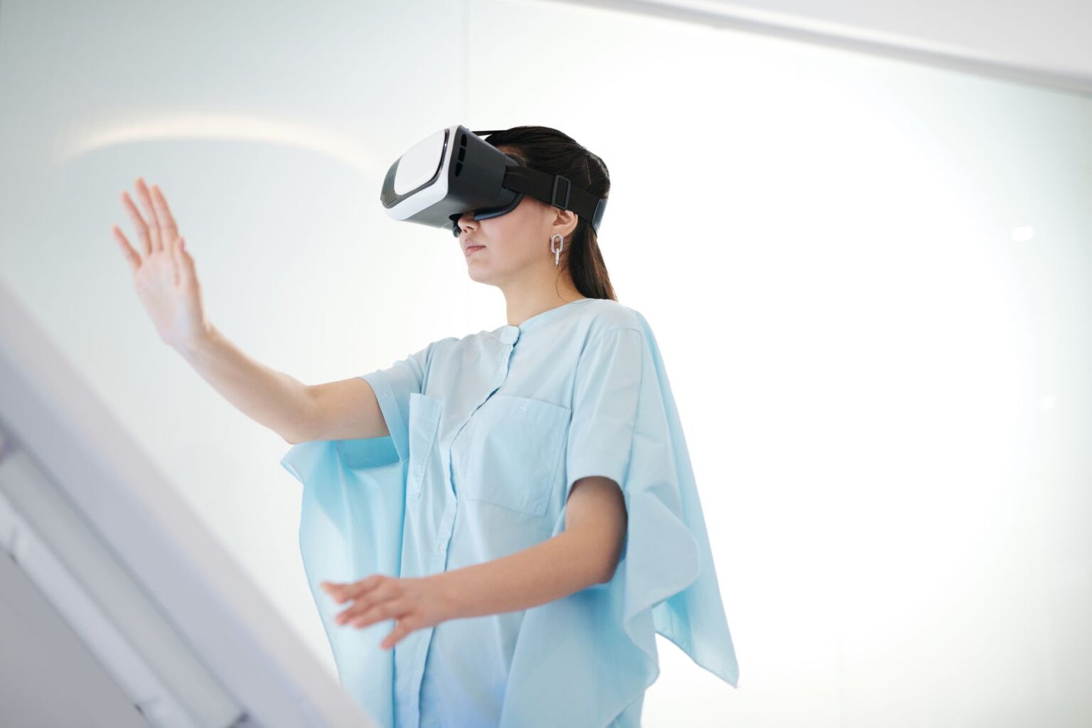 Google’s Genie 4 World Model Adds Audio and More Realistic Worlds A person interacting with an immersive virtual simulation environment