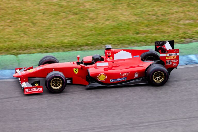 Apple TV Adds Dolby Atmos to F1 Broadcasts Starting in Texas Formula 1 race car on circuit track during race day