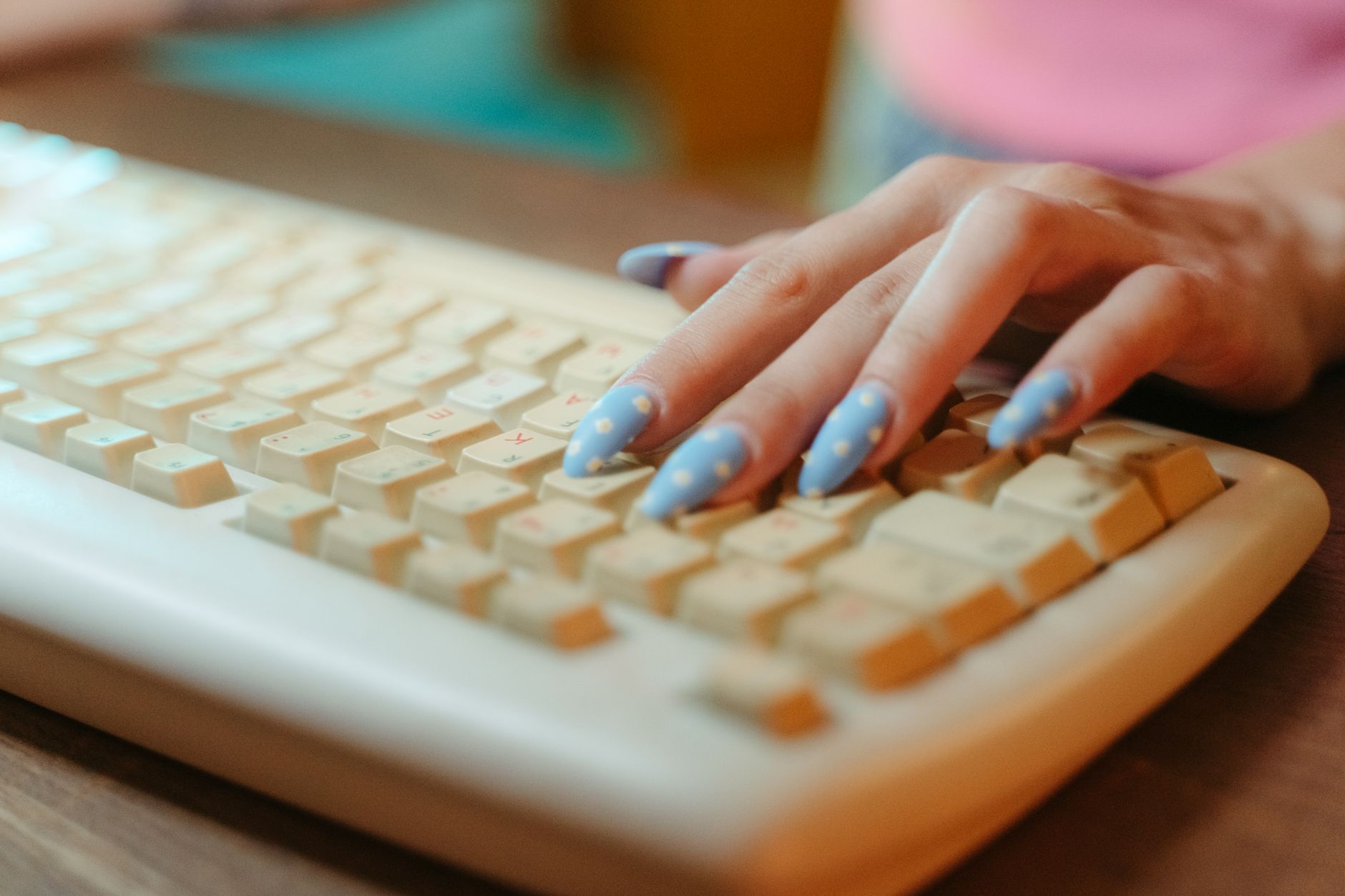 Person typing on a mechanical keyboard with visible switches