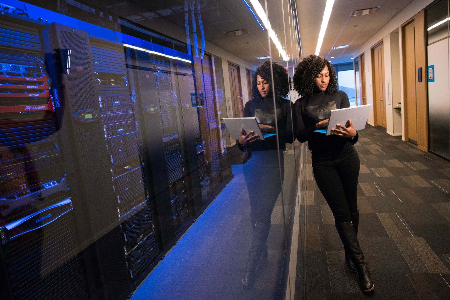 Server room with rows of data storage hardware used for AI model training