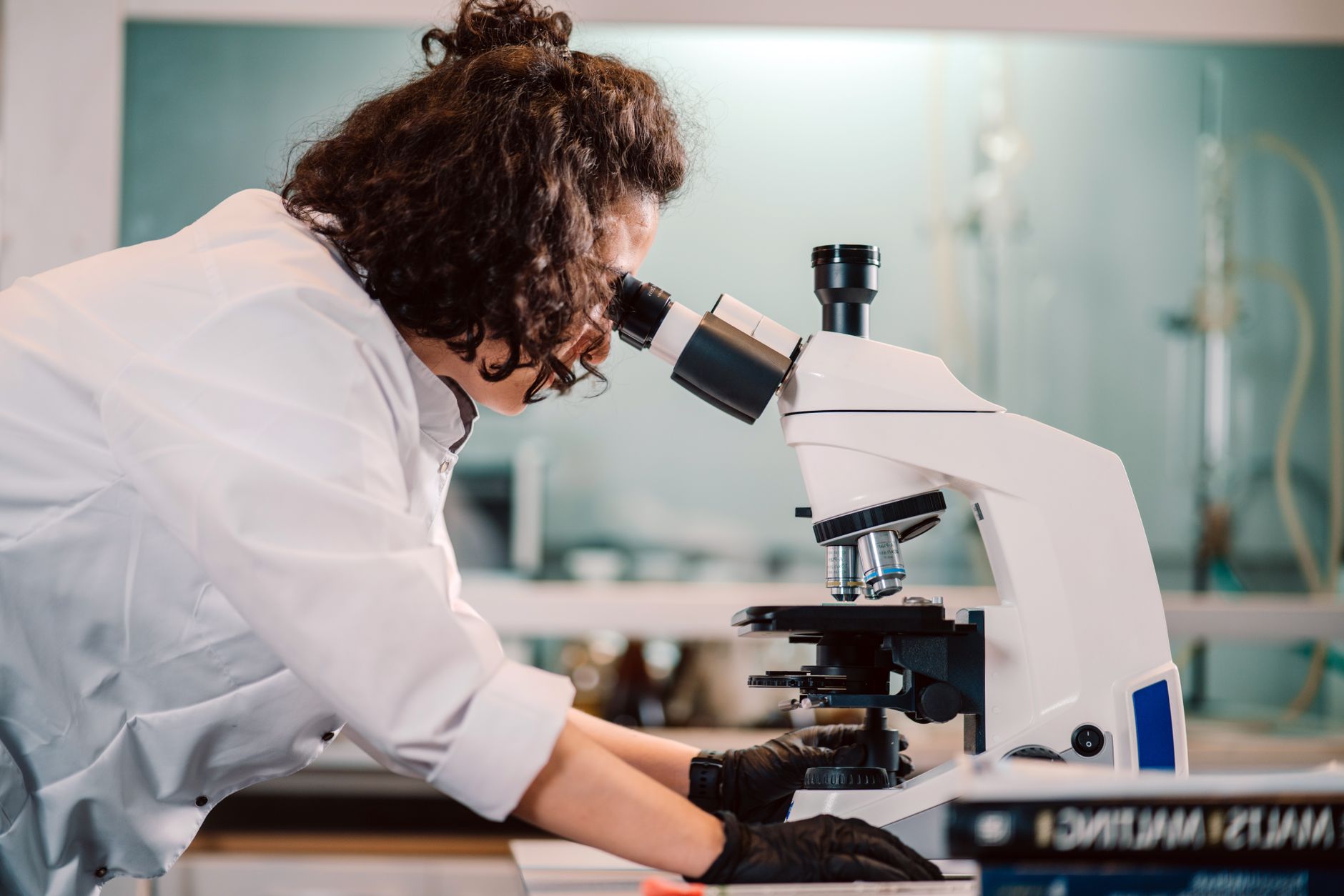 Researcher examining samples in a biology laboratory
