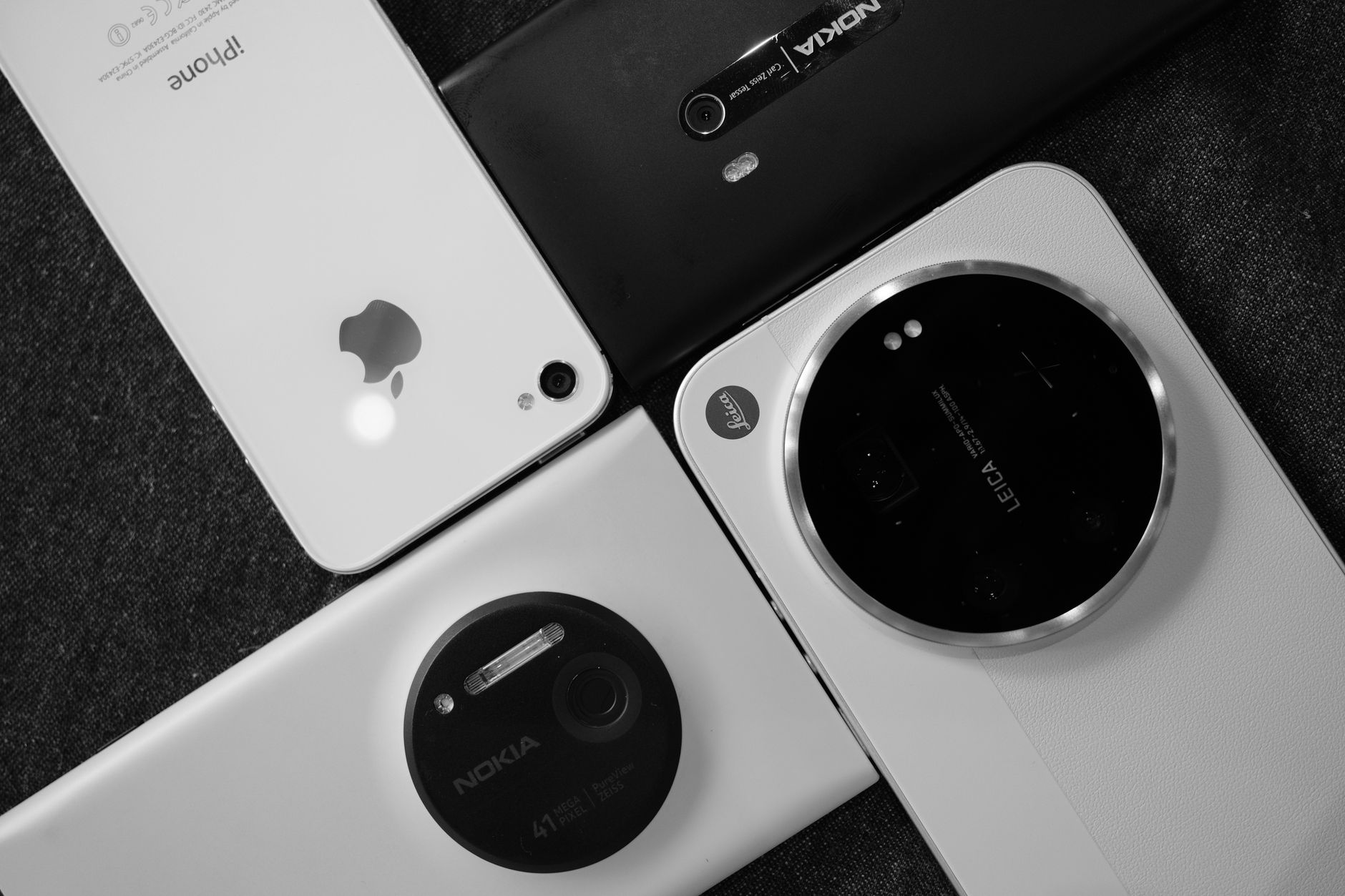 Two smartphones side by side with camera lenses visible for comparison