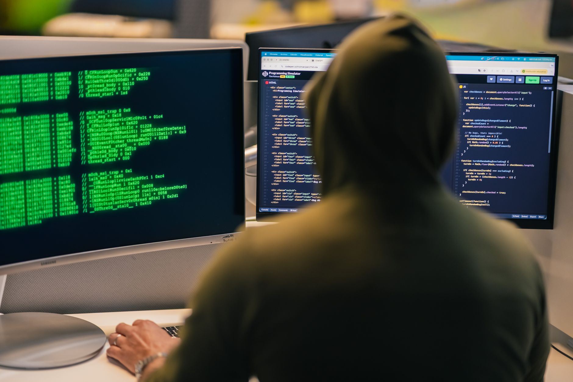 Developer looking at code on a dark monitor screen representing a security vulnerability