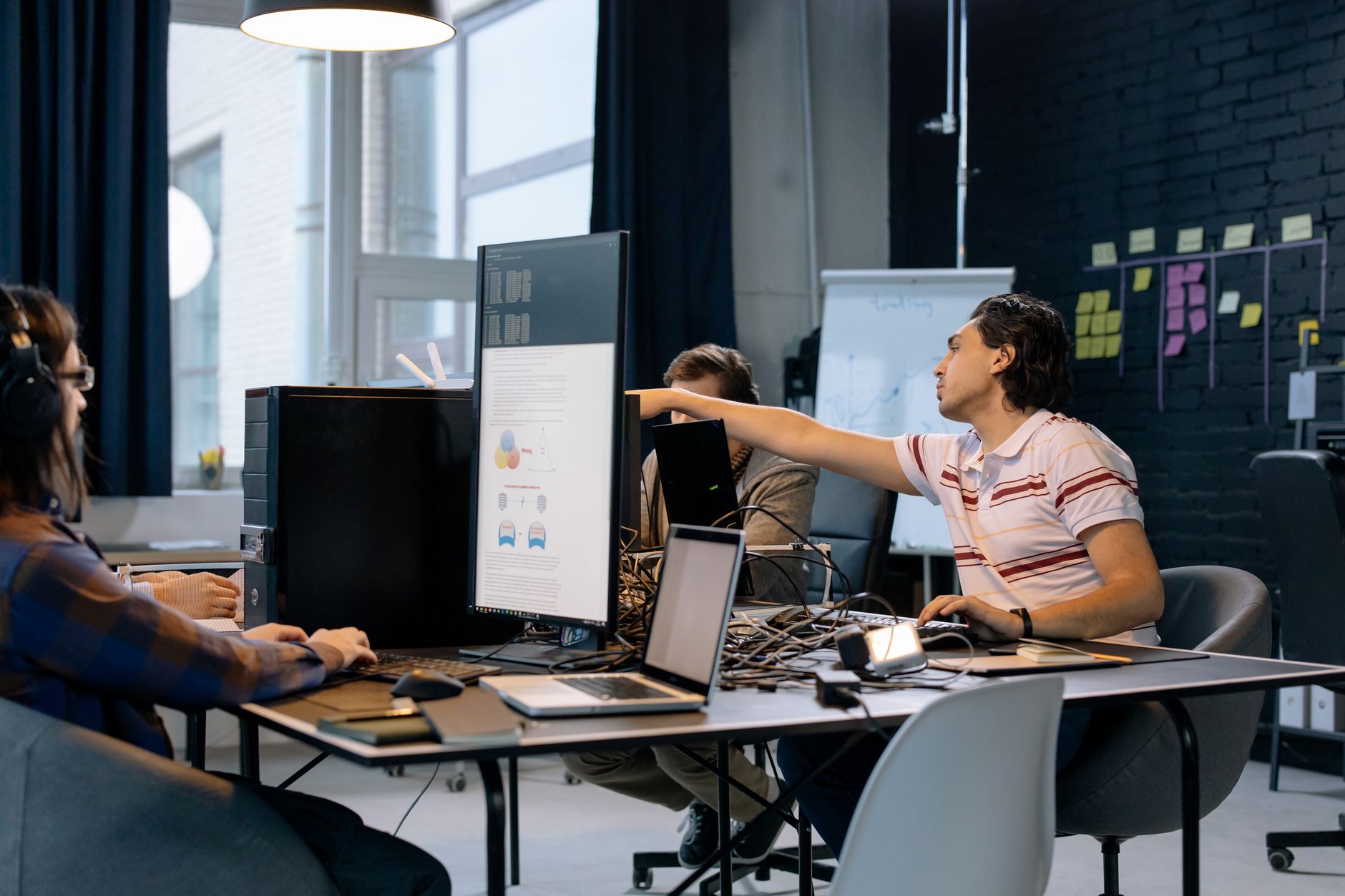 Modern technology company office with employees working at computers