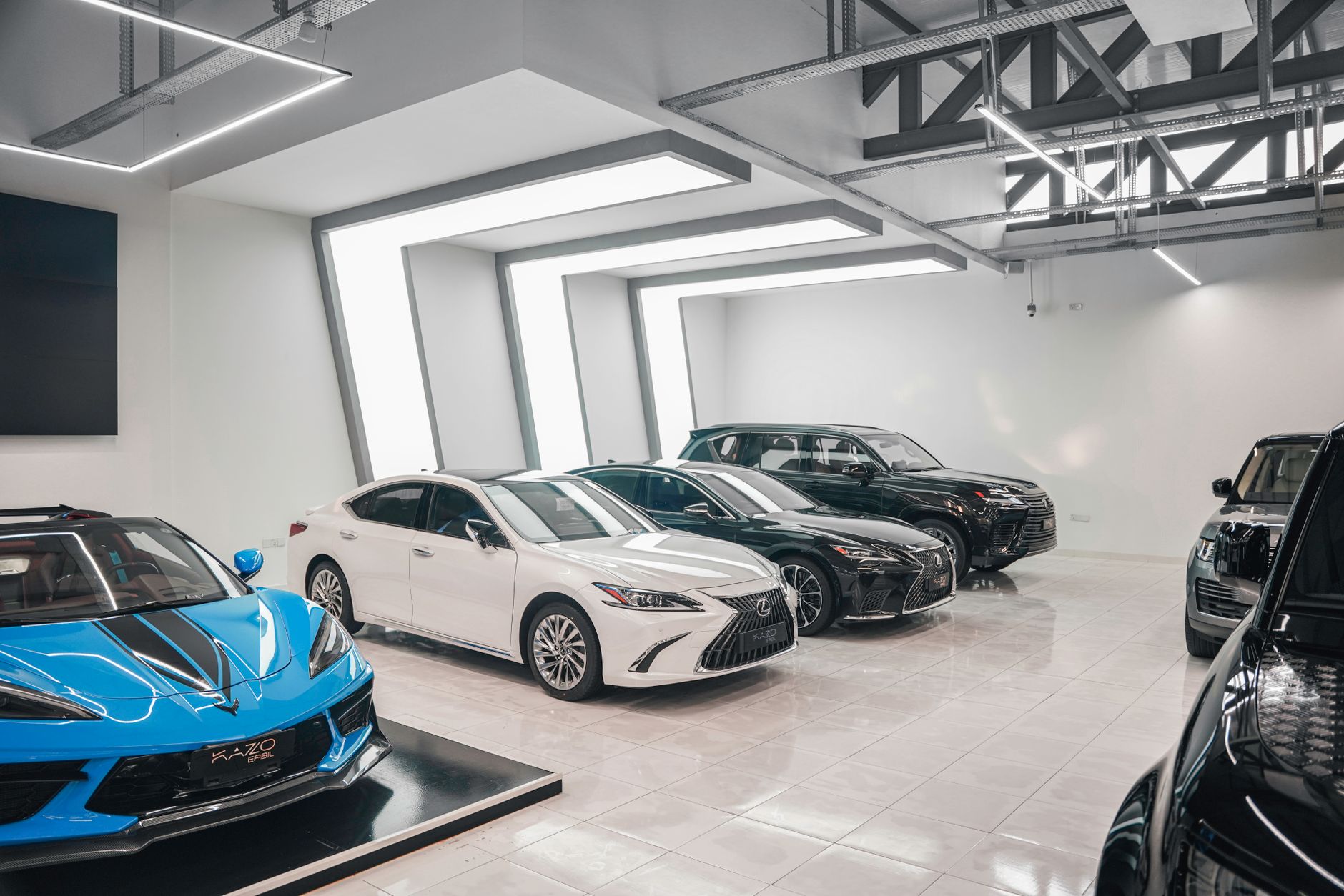 New cars on display inside a dealership showroom