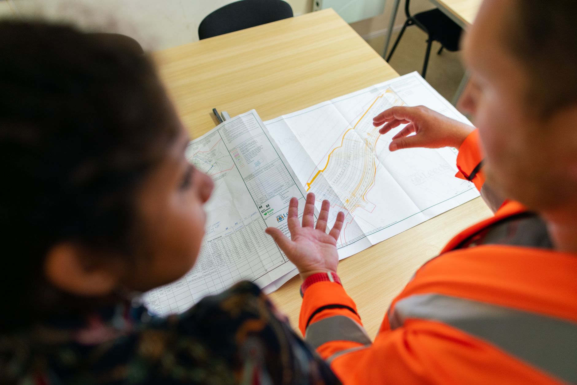 Engineers collaborating on technical deployment in a modern office environment