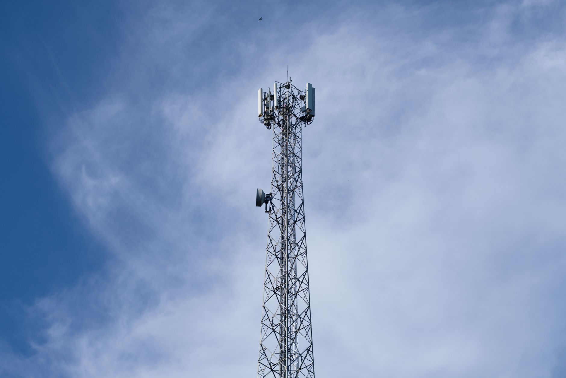 A remote rural home with a satellite internet dish on the roof