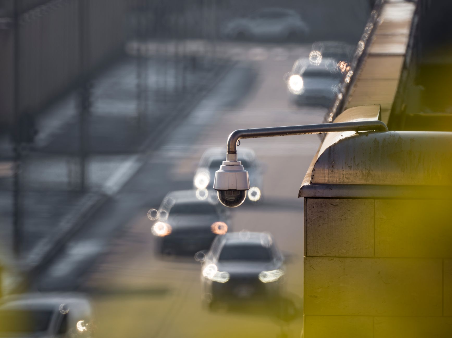 Security surveillance camera mounted on a city street